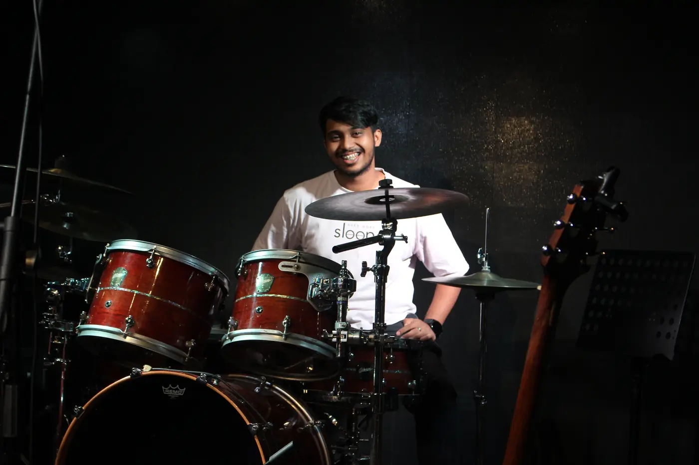 Drummer smiling behind the kit at Open Day 2025