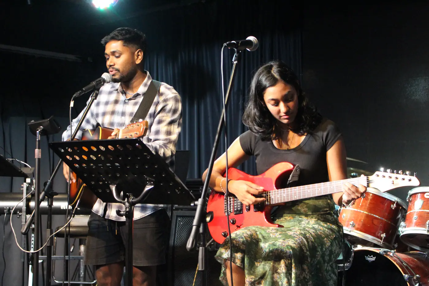 Two guitarists performing at Open Day 2025