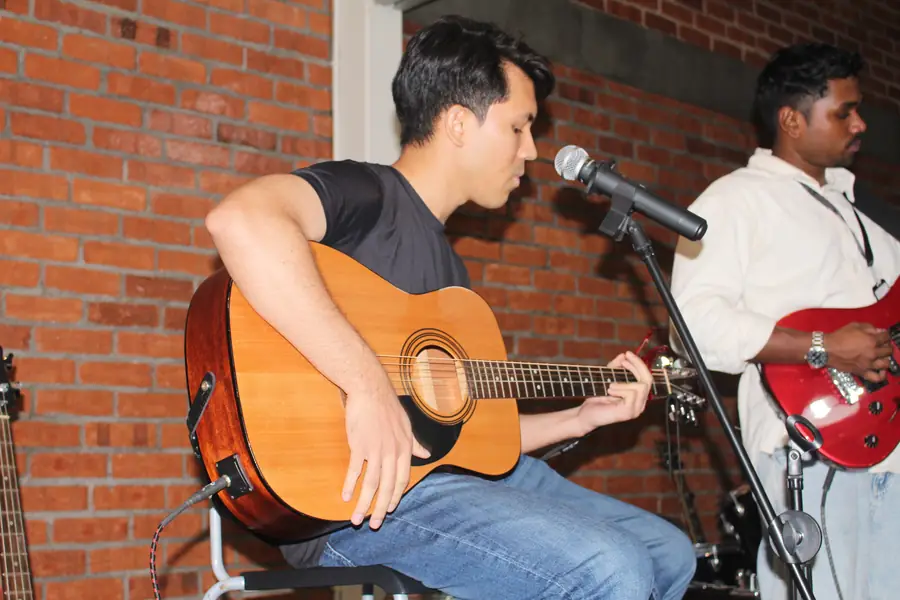 Acoustic guitarist singing at Live Concert 3.0
